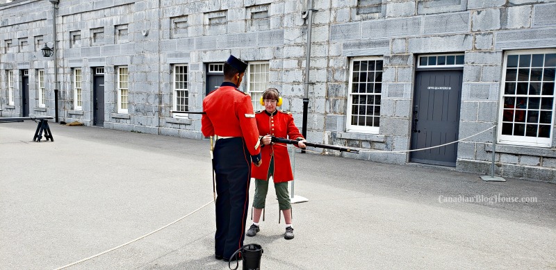 Firing a musket at Fort Henry in Historic Downtown Kingston