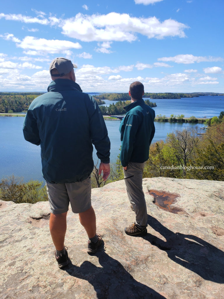 Parks Canada staff at lookout at Landon Bay
