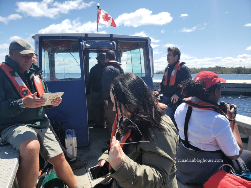 Parks Canada staff and Canadian writers on board a Parks Canada boat